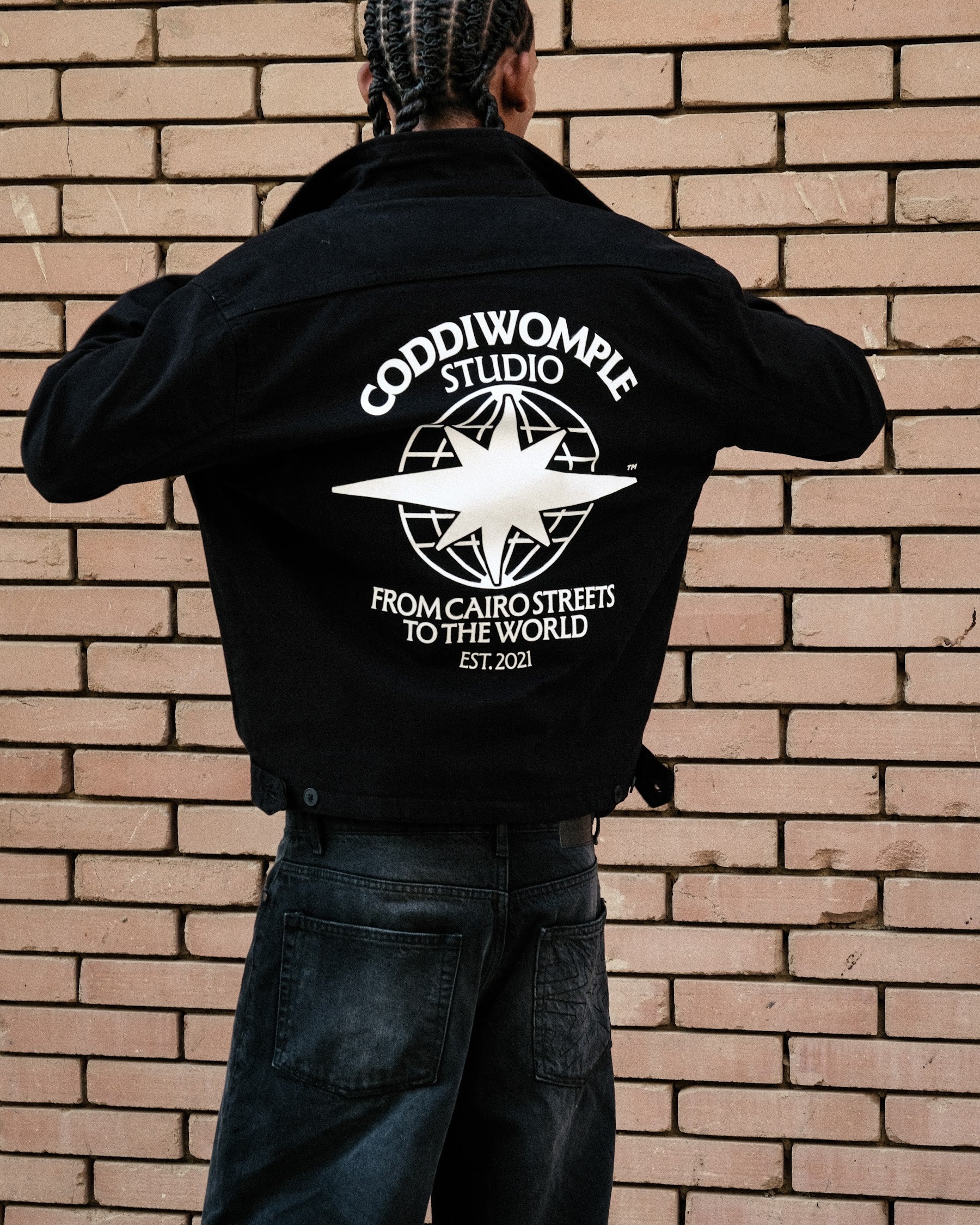 Coddiwomple Black Work Jacket V2, back print on model