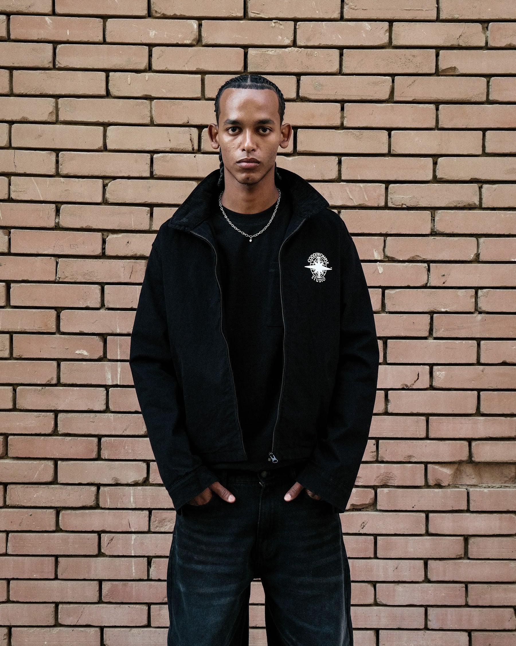 Coddiwomple Black Work Jacket V2, front on model