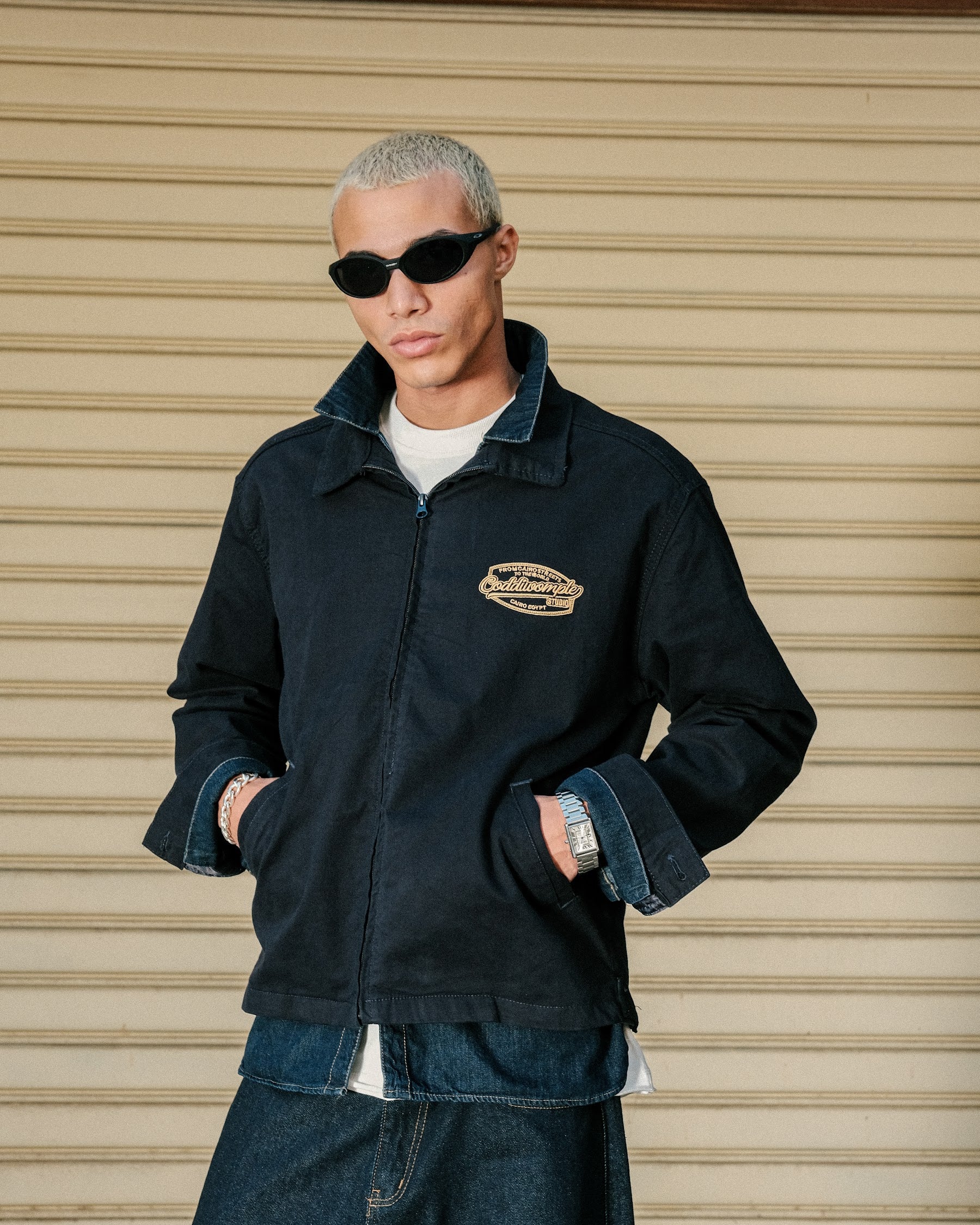 Coddiwomple Navy Work Jacket, chest badge on model